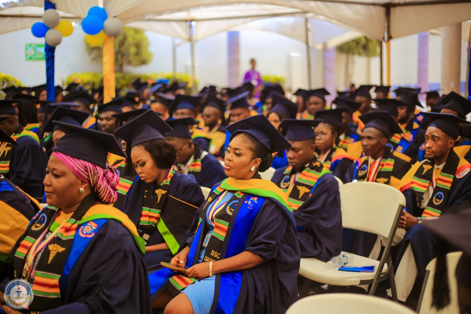 Graduates celebrating at Klintaps University College graduation ceremony