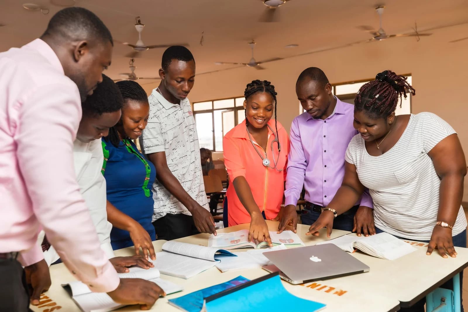 Klintaps students collaborating with laptops