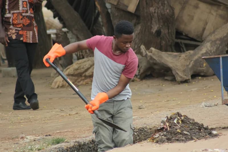 Students during the community clean-up exercise in Klagon